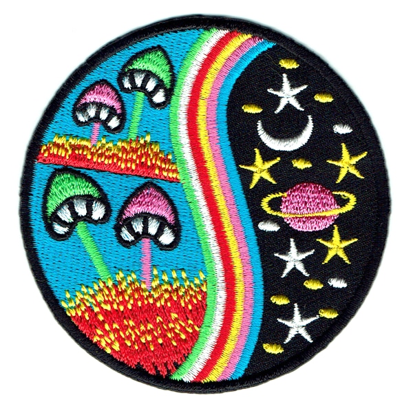 Round embroidered patch featuring mushrooms stars and planets.