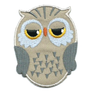 Brown iron on embroidered owl patch with black and yellow eyes.