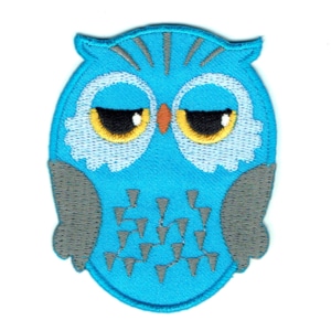 Aqua blue iron on embroidered owl patch with black and yellow eyes.