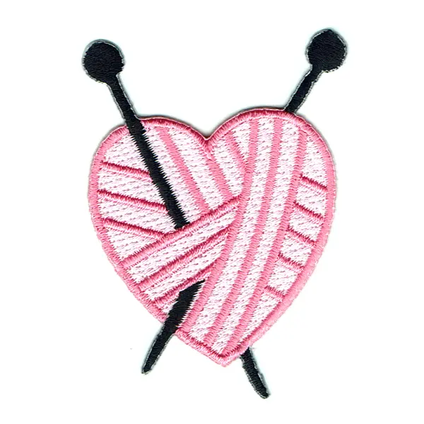 Iron on embroidered patch of a pink woollen ball in the shape of a heart with two knitting needles