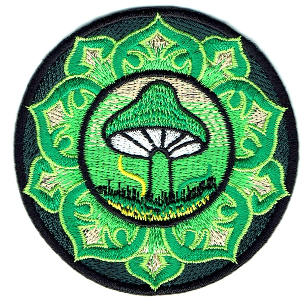 Round iron on embroidered patch of a lotus style emblem with a mushroom in the centre.