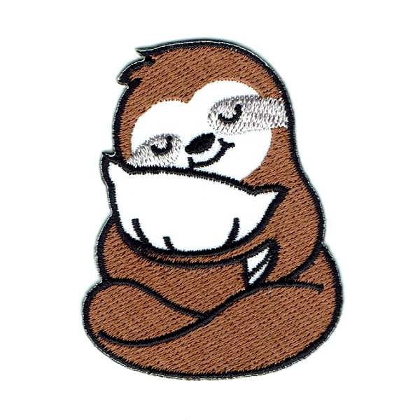 Iron on brown sloth patch cuddling a white pillow.
