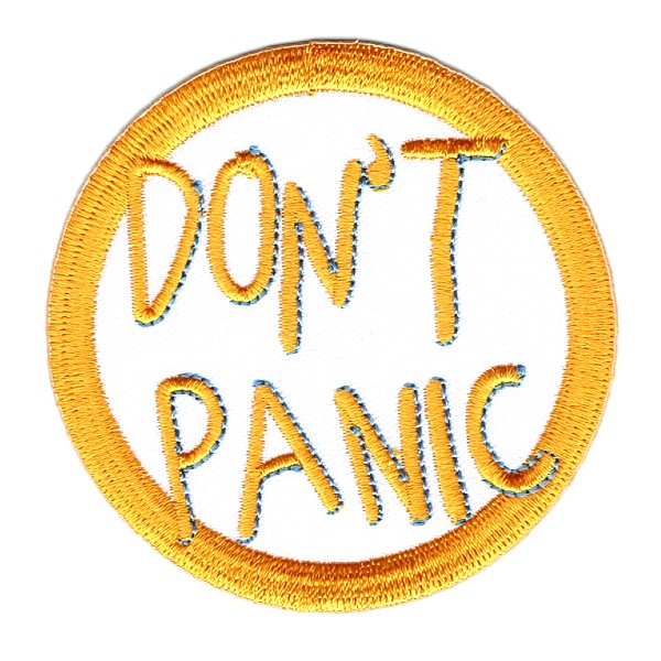 Round Iron On Patch With Don't Panic Embroidered in Yellow